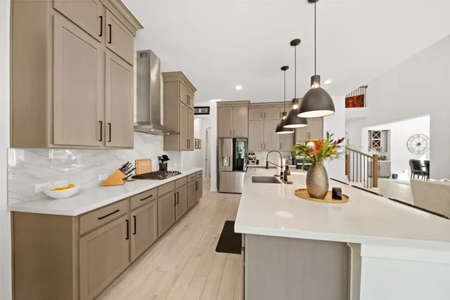 a kitchen with a sink a stove and cabinets