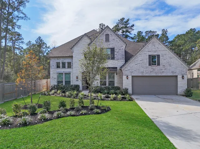 an aerial view of a house with swimming pool and sitting space