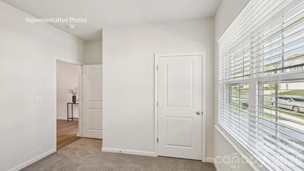 a view of a room with large windows