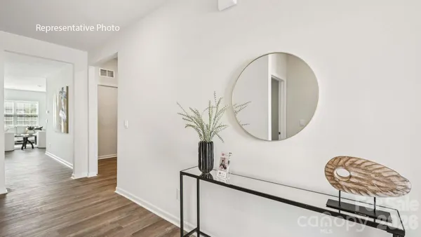 an entryway with wooden floor