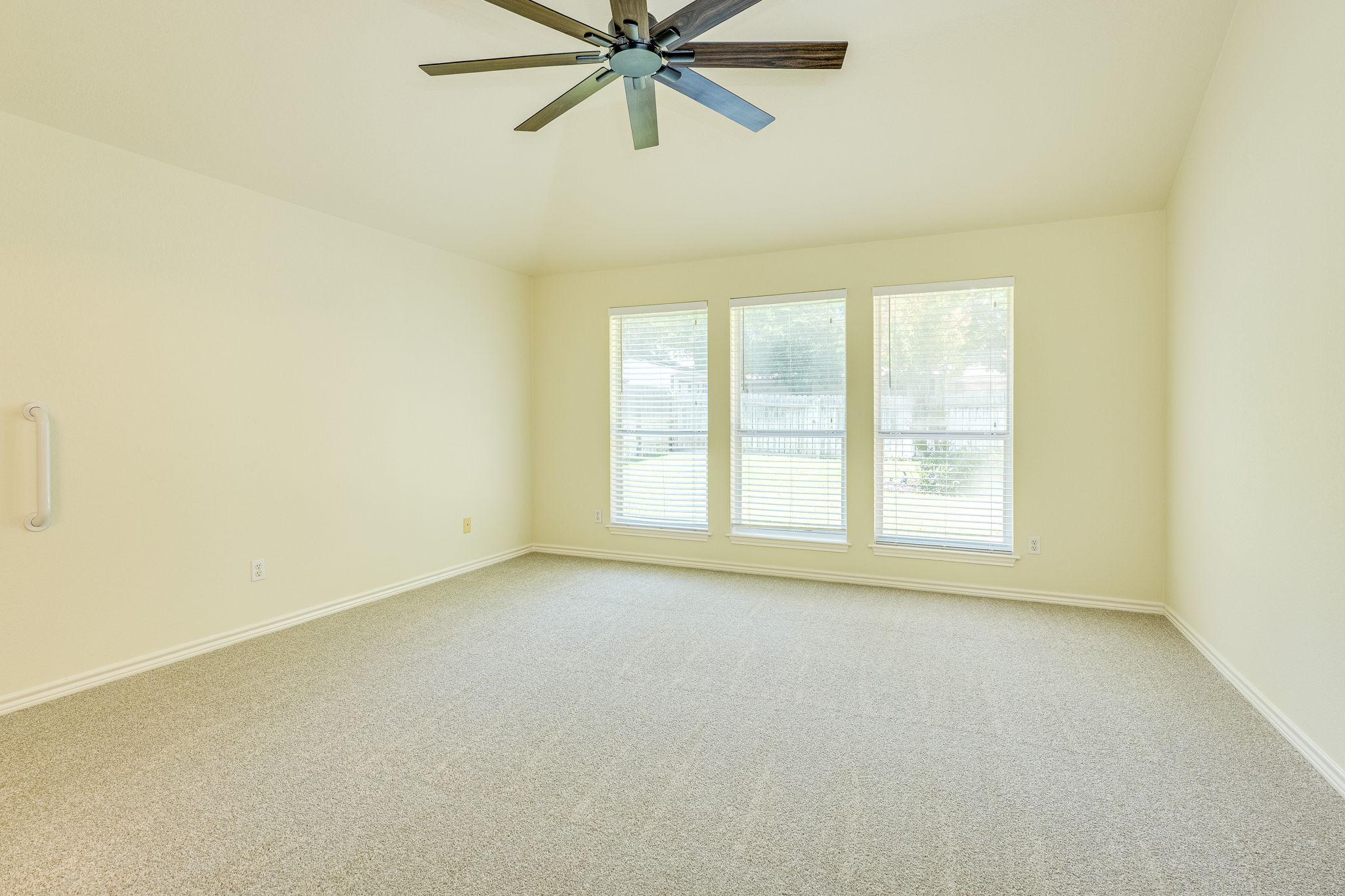111 Arrowhead Lane Georgetown, TX 78628 - Photo 22 of 40 an empty room with a window and a fan