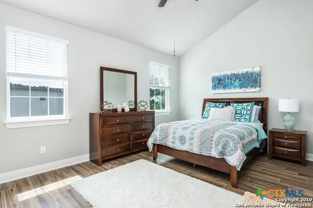 a bedroom with a bed and a dresser