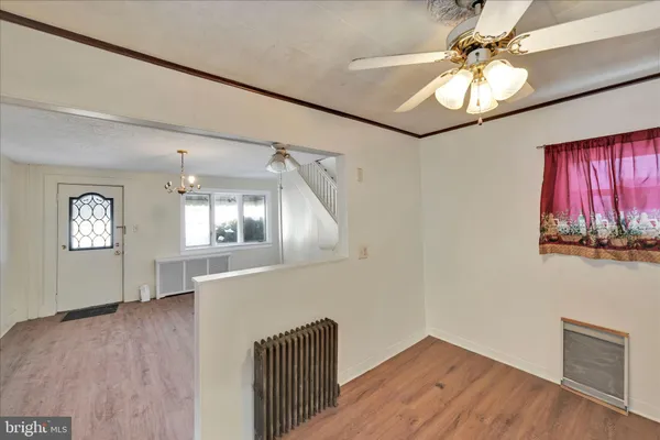 a kitchen with cabinets appliances and a window