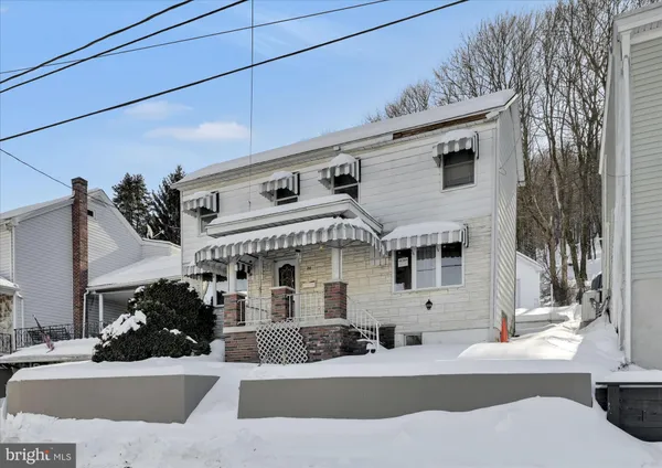 a front view of a house with a outdoor space