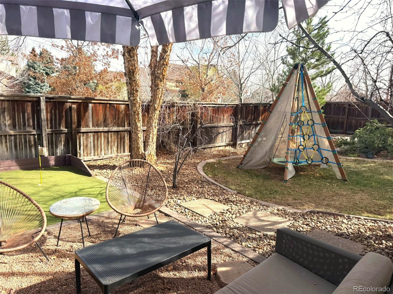 180 South Oneida Street Denver, CO 80230 - Photo 8 of 40 a view of a swimming pool with a lounge chairs