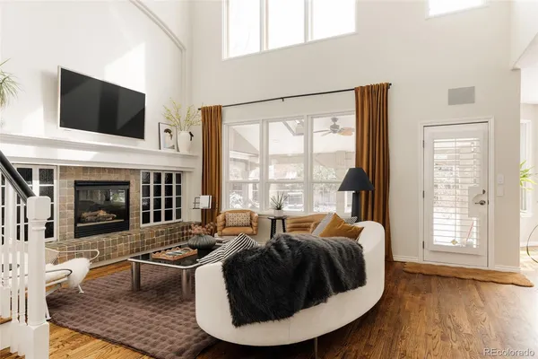 a living room with fireplace furniture and a flat screen tv