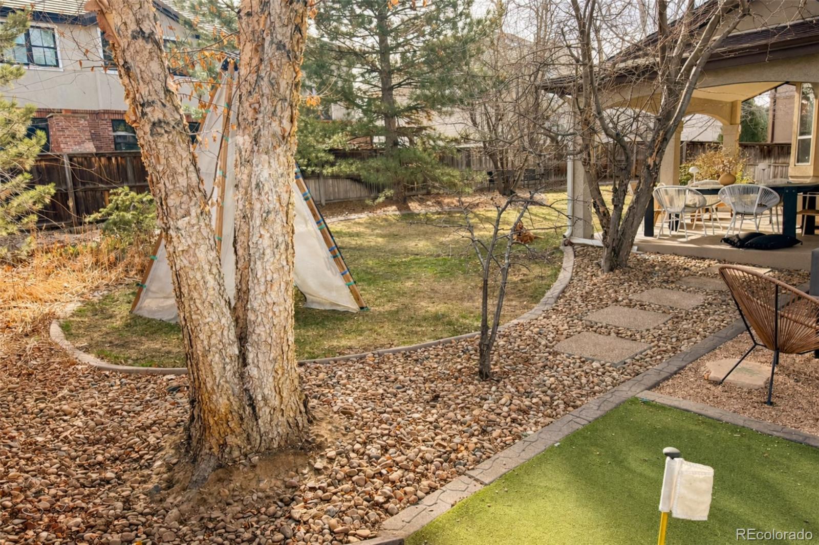 180 South Oneida Street Denver, CO 80230 - Photo 9 of 40 a view of a yard with swimming pool