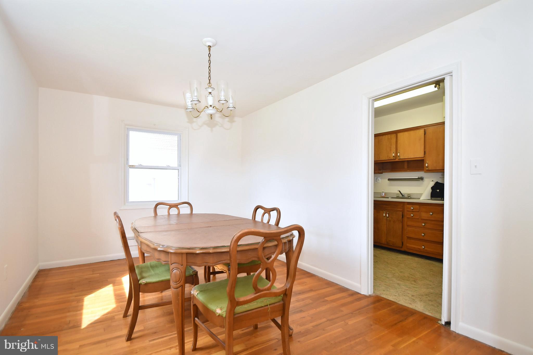 1762 Stokesley Road Baltimore, MD 21222 - Photo 7 of 30 Dining room with hardwood flooring.