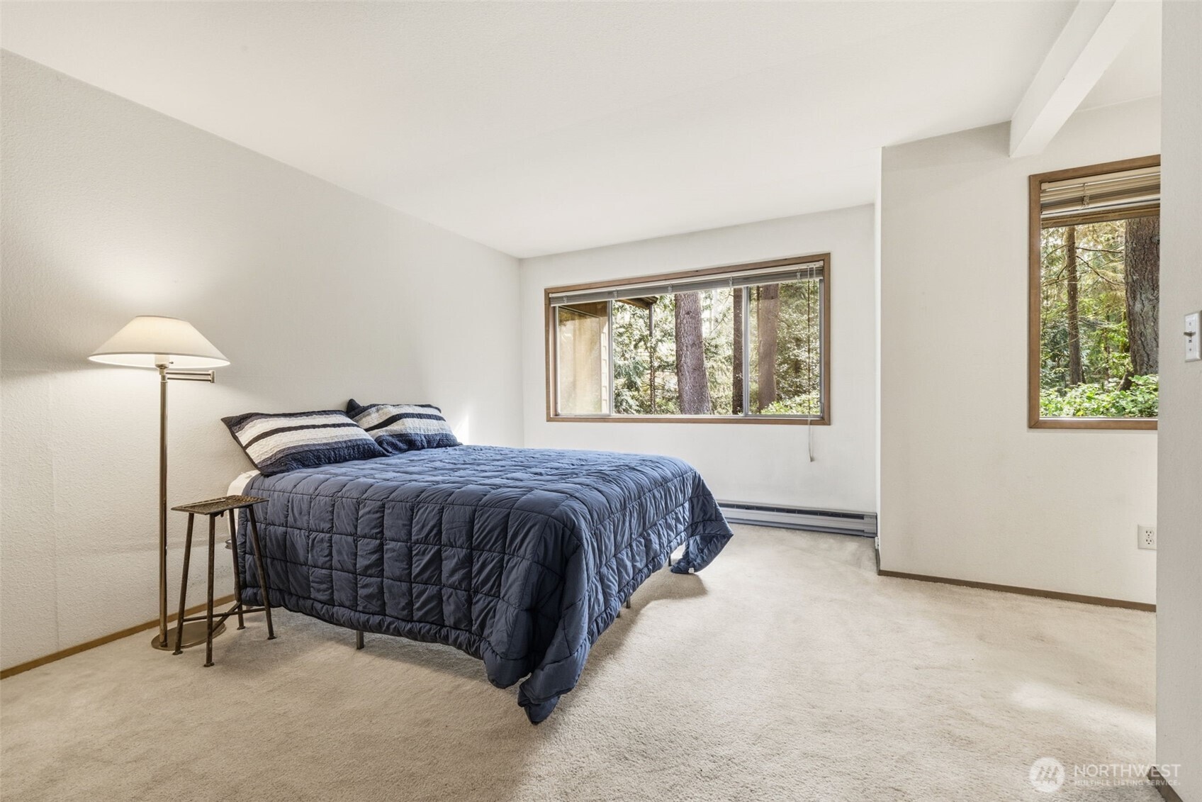 20319 92nd Avenue West Edmonds, WA 98020 - Photo 11 of 26 a spacious bedroom with a bed and a window