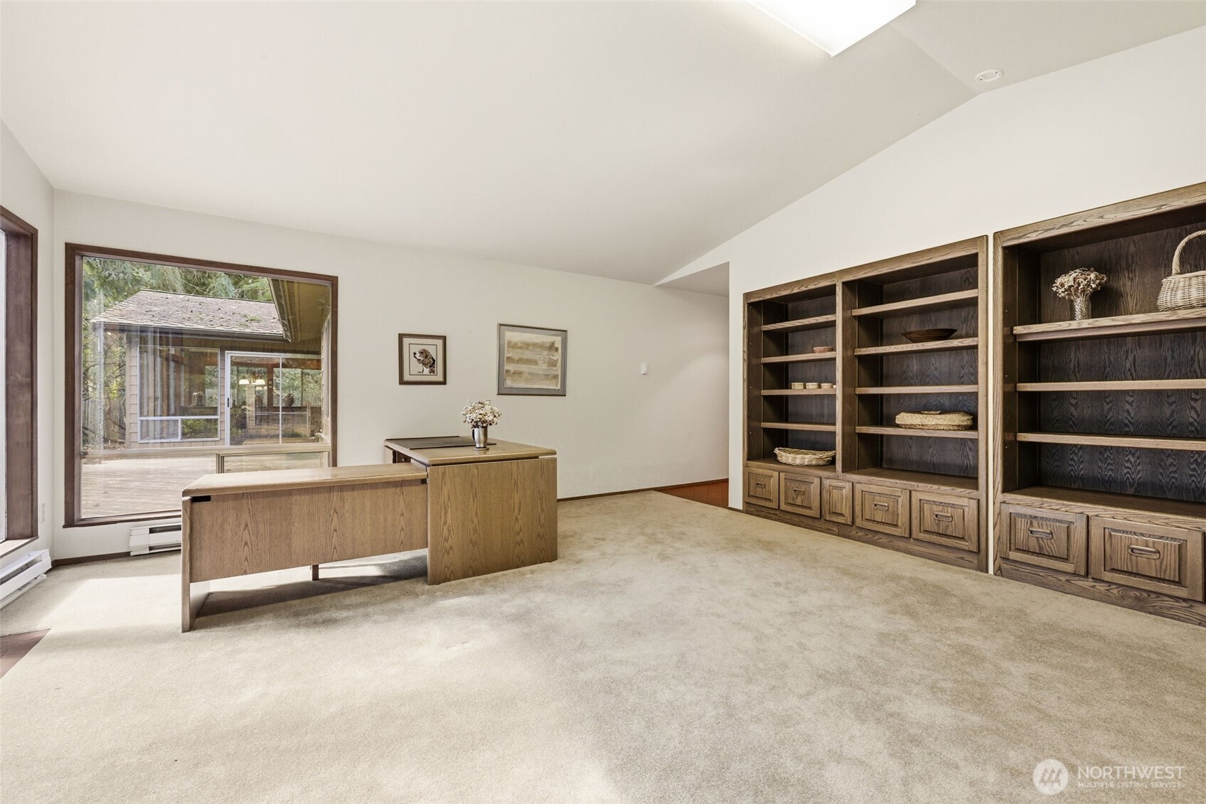 20319 92nd Avenue West Edmonds, WA 98020 - Photo 14 of 26 an empty room with a fireplace and cabinet