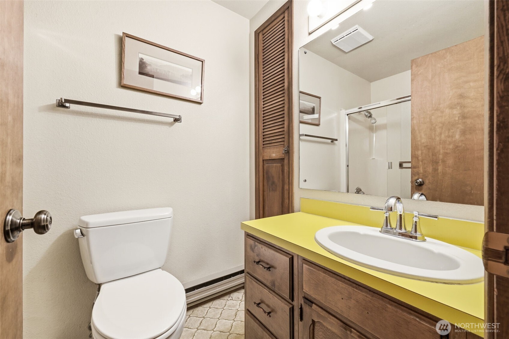 20319 92nd Avenue West Edmonds, WA 98020 - Photo 16 of 26 a bathroom with a granite countertop toilet sink and mirror