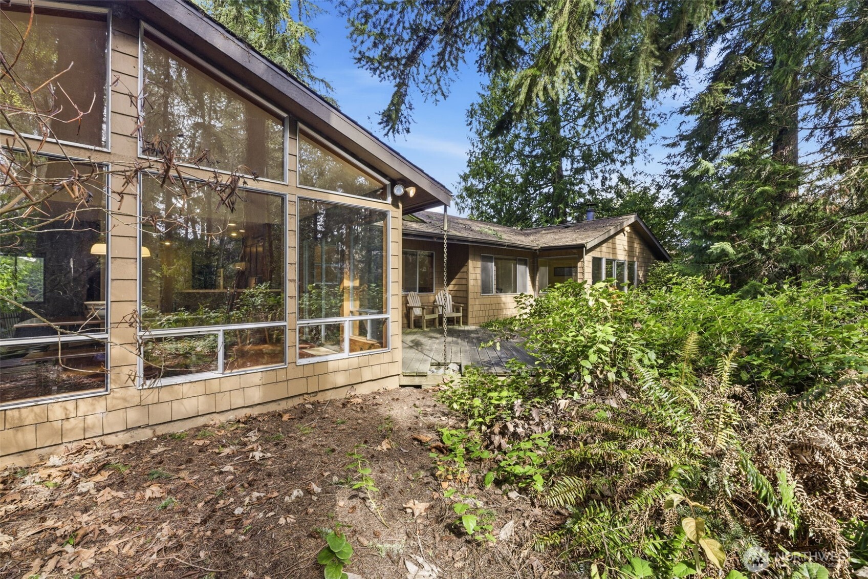 20319 92nd Avenue West Edmonds, WA 98020 - Photo 20 of 26 a house with lots of trees in the background