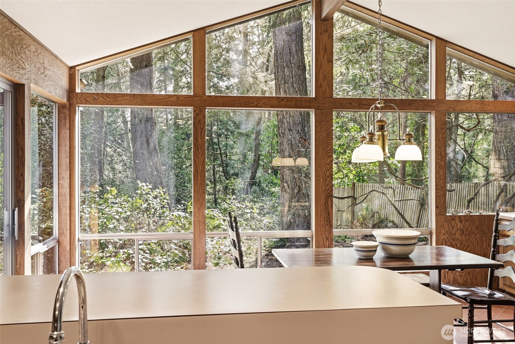 20319 92nd Avenue West Edmonds, WA 98020 - Photo 4 of 26 a living room with large windows and a table