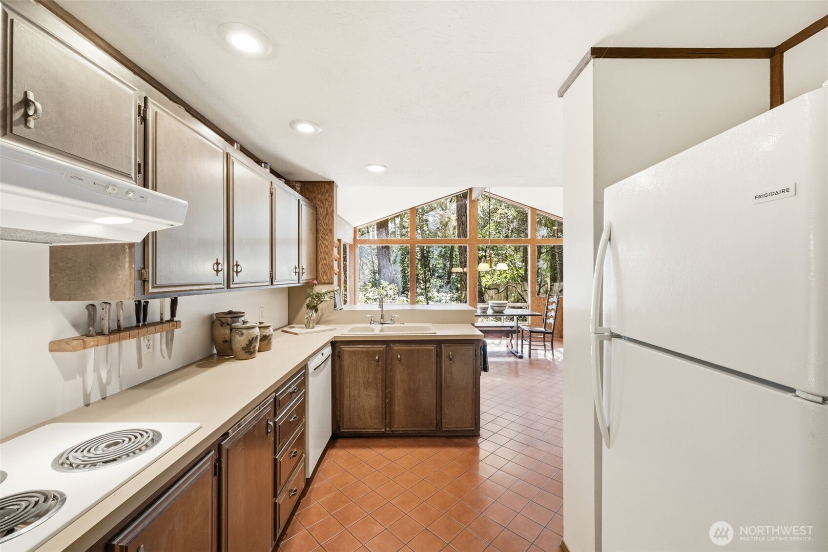 20319 92nd Avenue West Edmonds, WA 98020 - Photo 9 of 26 a kitchen with a sink a stove and cabinets