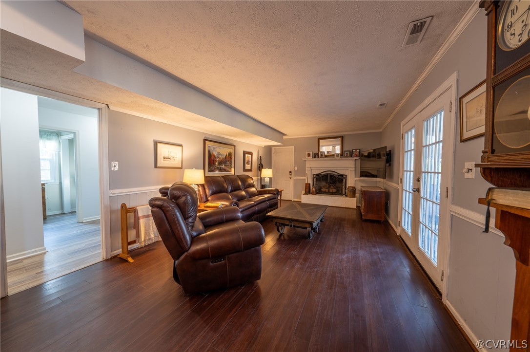 6720 Greenyard Road Chester, VA 23831 - Photo 29 of 46 a living room with furniture and a wooden floor