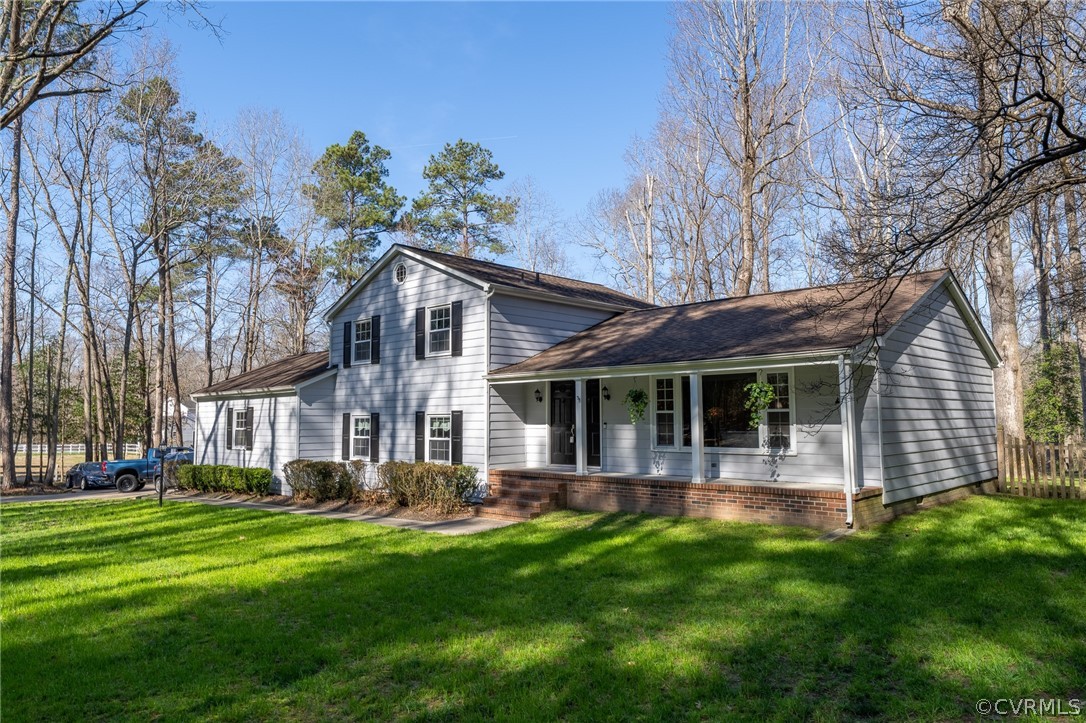 6720 Greenyard Road Chester, VA 23831 - Photo 3 of 46 a front view of house with yard and outdoor seating