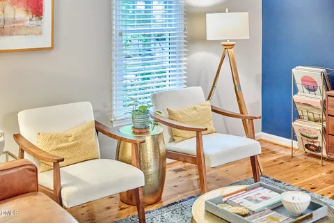 a living room with furniture and a table