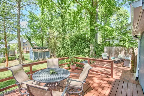 a view of a yard with furniture