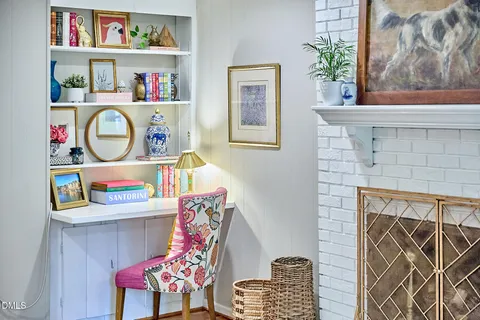 a room with furniture and a potted plant