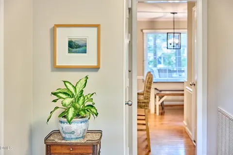 a living room with furniture a window and a flat screen tv