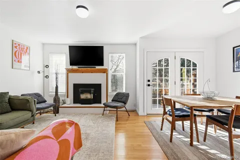 a living room with furniture fireplace and a flat screen tv