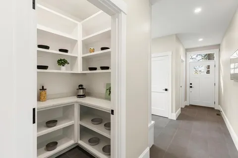 a view of an empty room with shelves