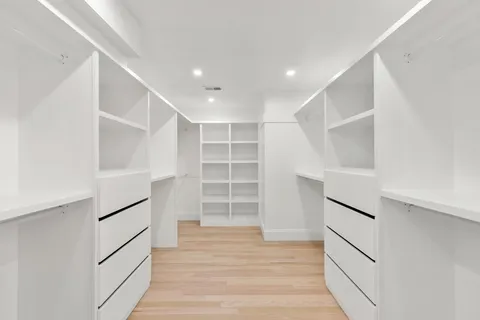 a view of an empty walk in closet