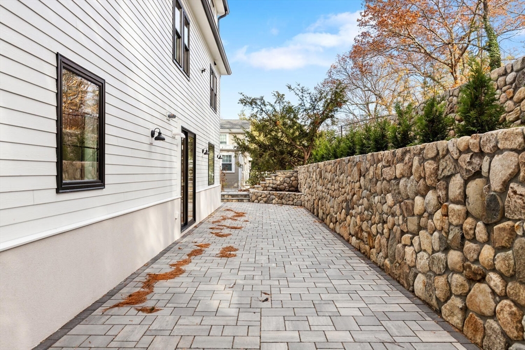 19 Town Way Winchester, MA 01890 - Photo 37 of 42 a view of a pathway with a yard