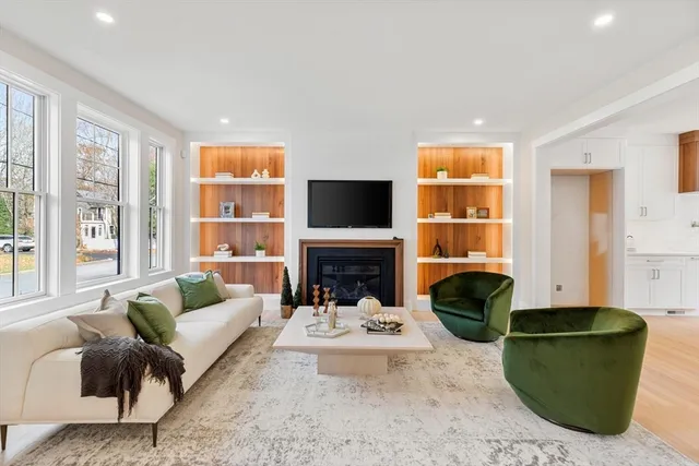 a living room with furniture fireplace and a flat screen tv