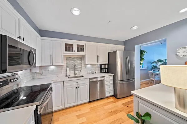 a open kitchen with a table and chairs in it