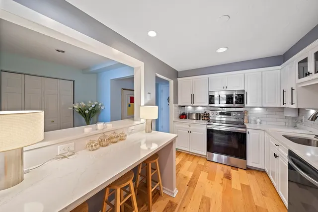 a kitchen with a table and chairs in it