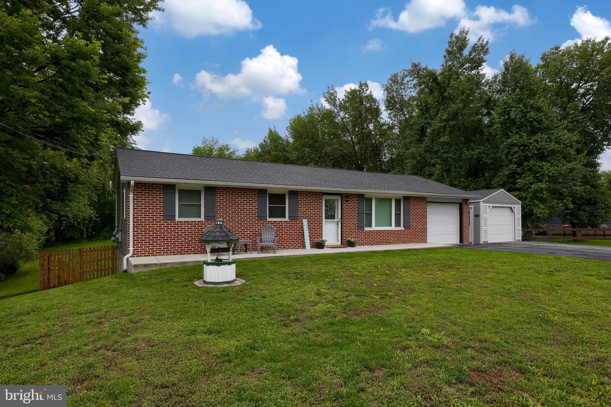699 River Corner Road Conestoga, PA 17516 - Photo 36 of 37 a front view of a house with garden