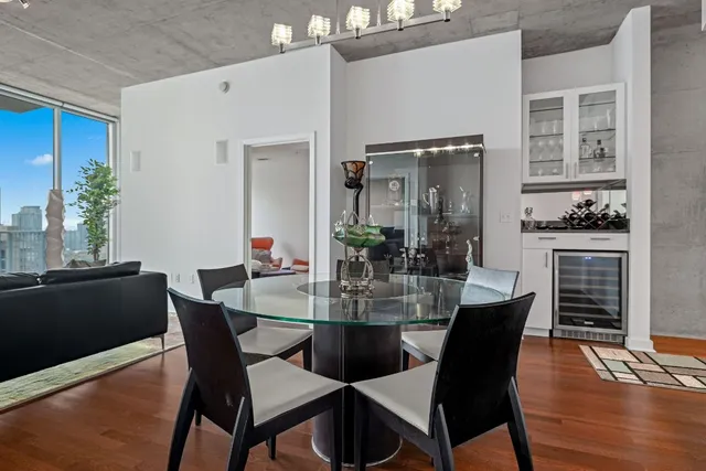 a view of a dining room with furniture window and wooden floor