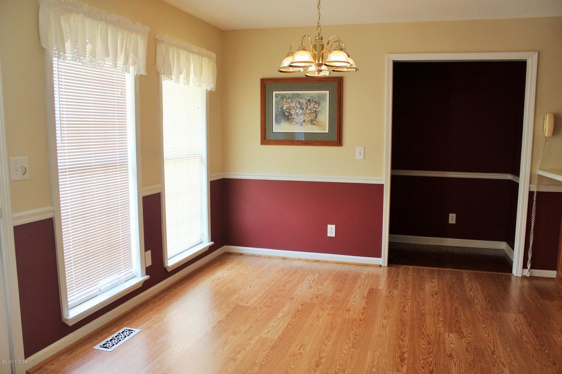 144 Gates Road Lizella, GA 31052 - Photo 14 of 44 a view of a livingroom with a chandelier