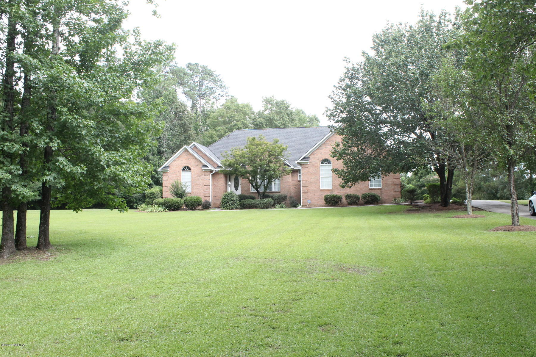 144 Gates Road Lizella, GA 31052 - Photo 3 of 44 a front view of a house with a yard and trees