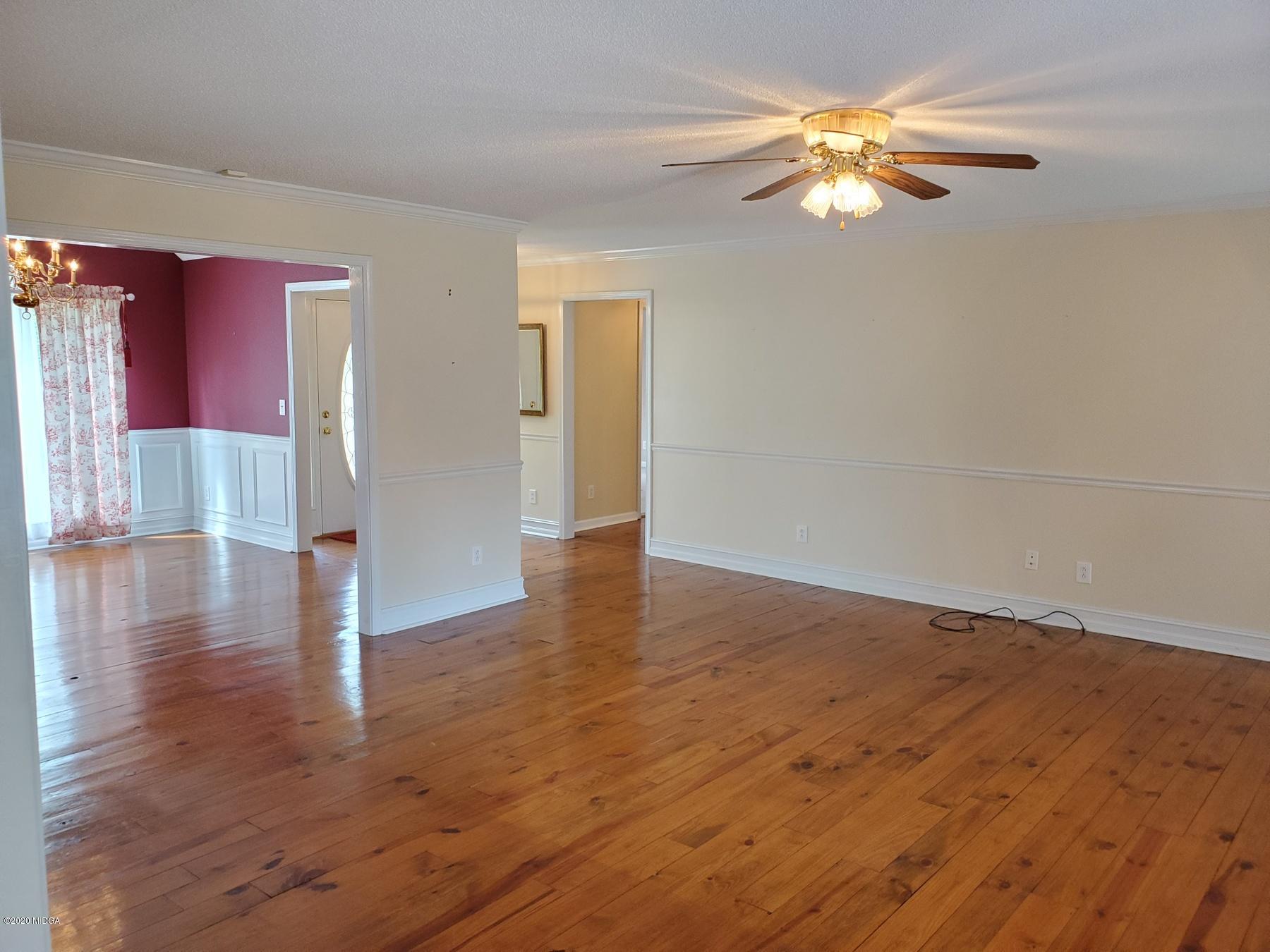 144 Gates Road Lizella, GA 31052 - Photo 23 of 44 a view of empty room with wooden floor