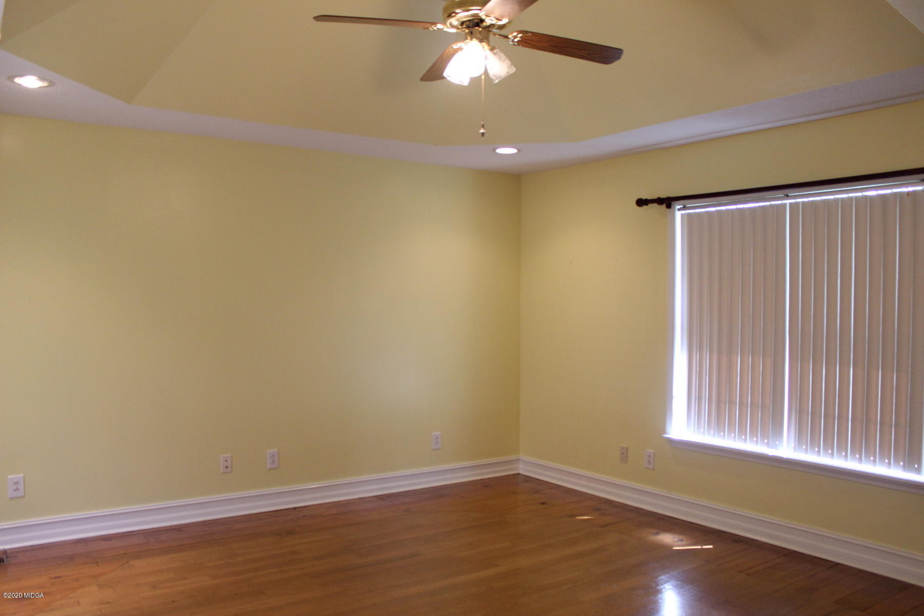 144 Gates Road Lizella, GA 31052 - Photo 25 of 44 an empty room with wooden floor and windows