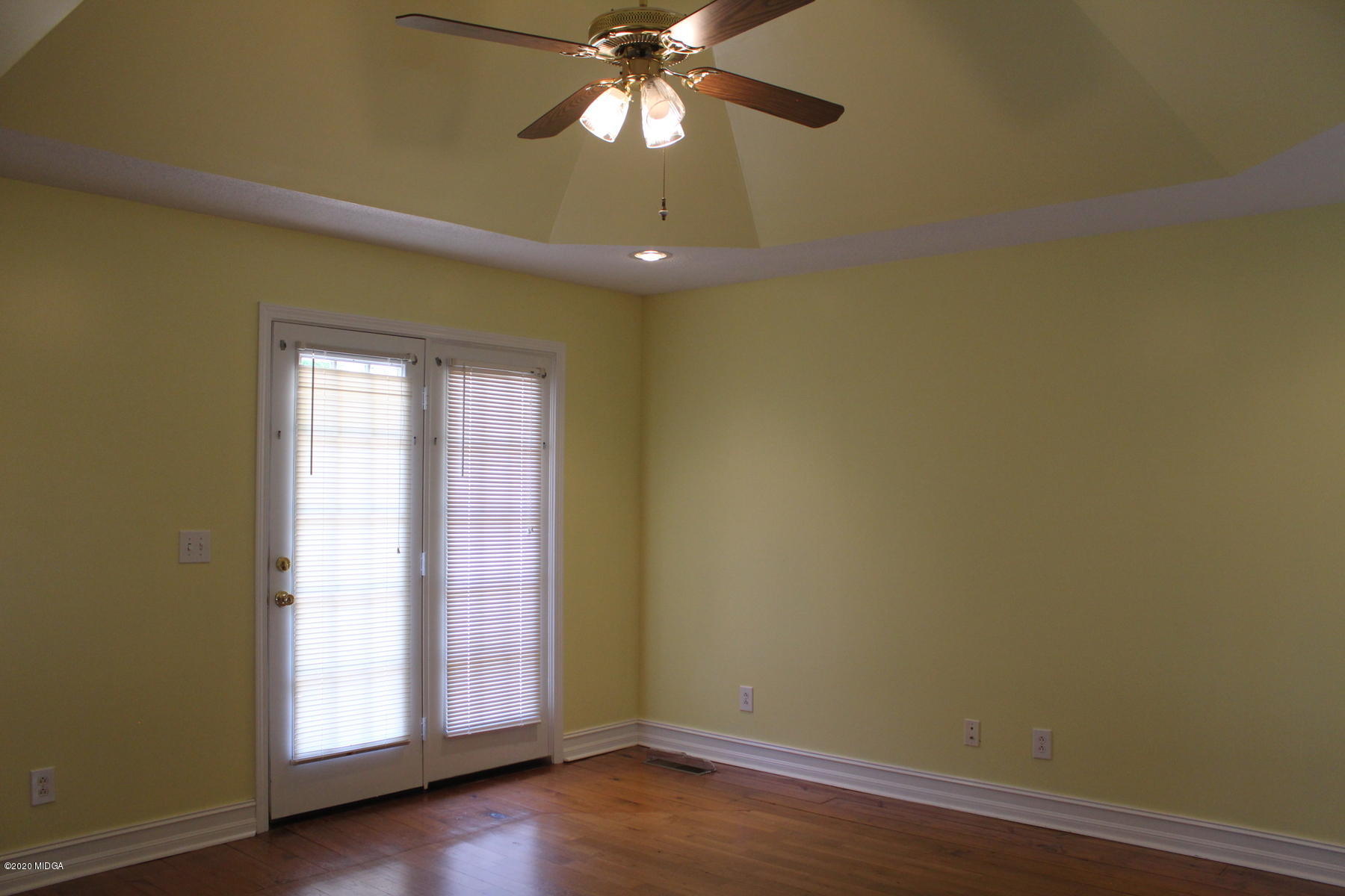 144 Gates Road Lizella, GA 31052 - Photo 26 of 44 an empty room with wooden floor and windows
