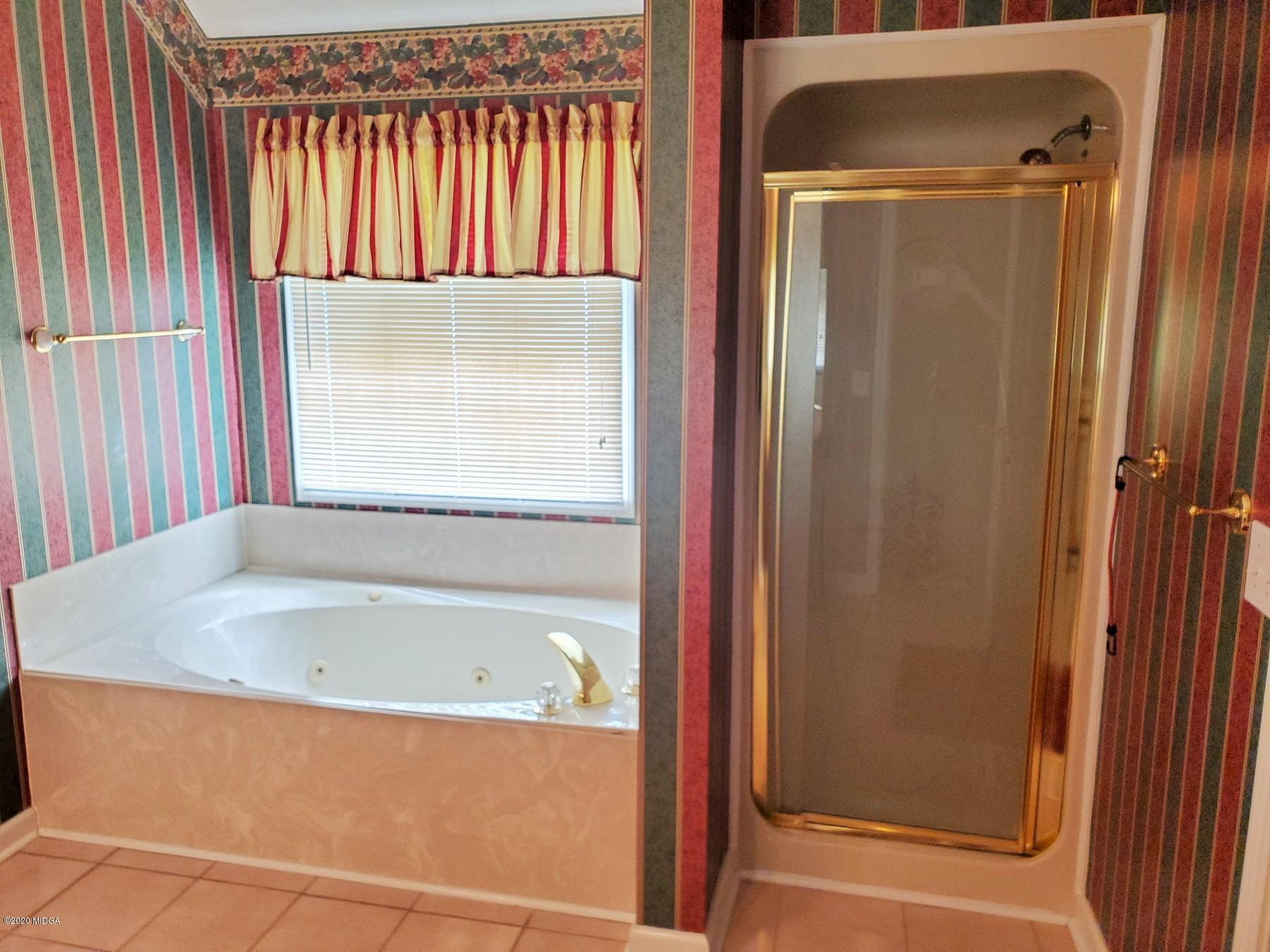 144 Gates Road Lizella, GA 31052 - Photo 30 of 44 a bathroom with a bathtub