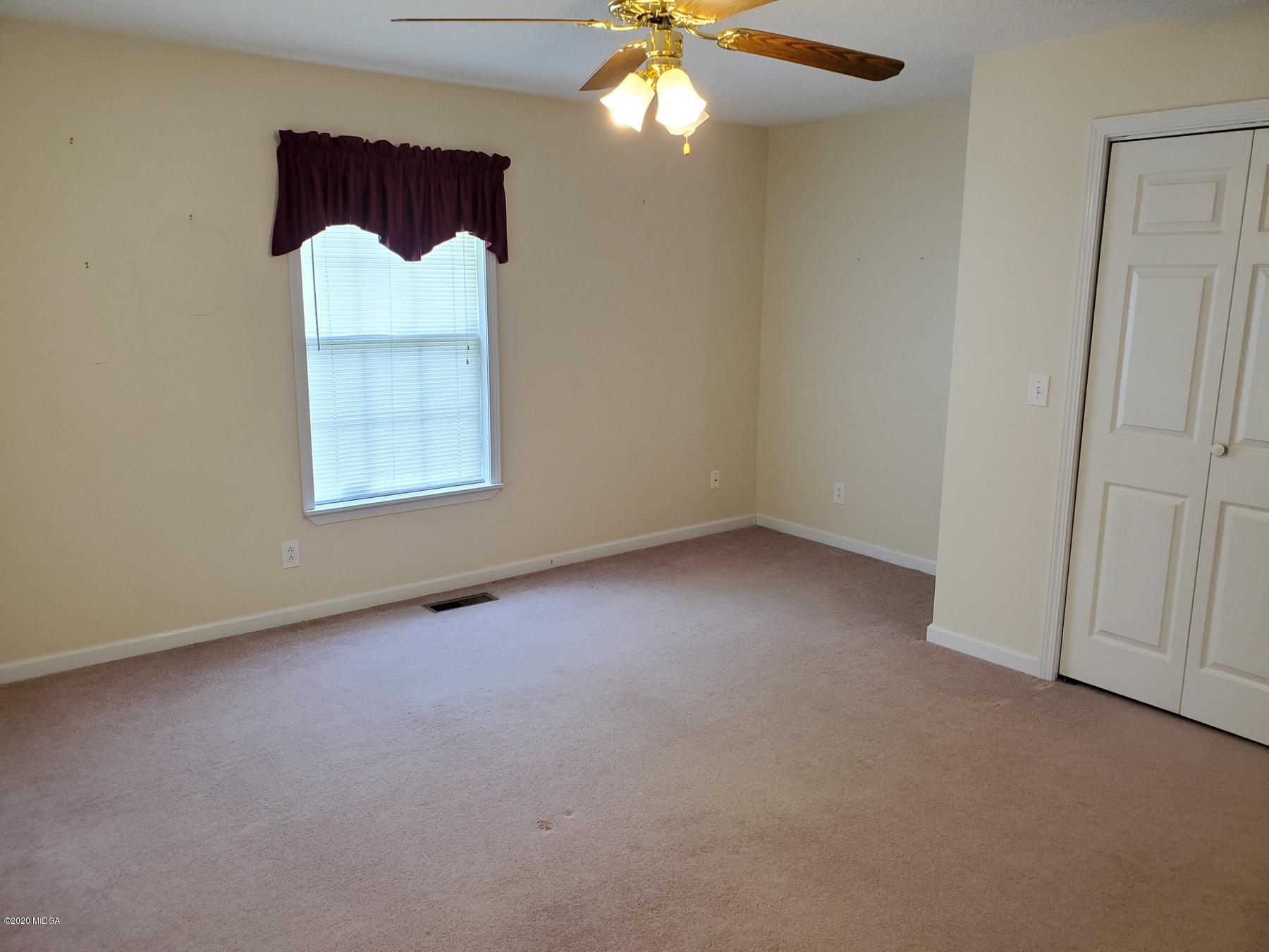 144 Gates Road Lizella, GA 31052 - Photo 38 of 44 an empty room with a window