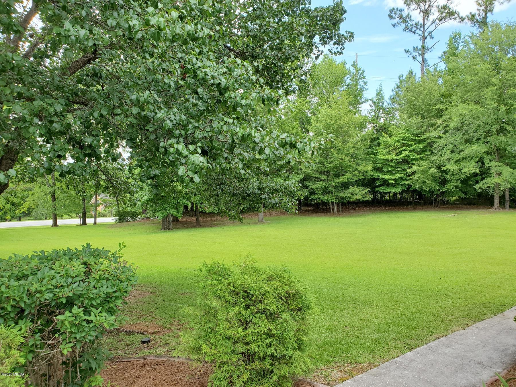 144 Gates Road Lizella, GA 31052 - Photo 7 of 44 a view of a field of grass and trees
