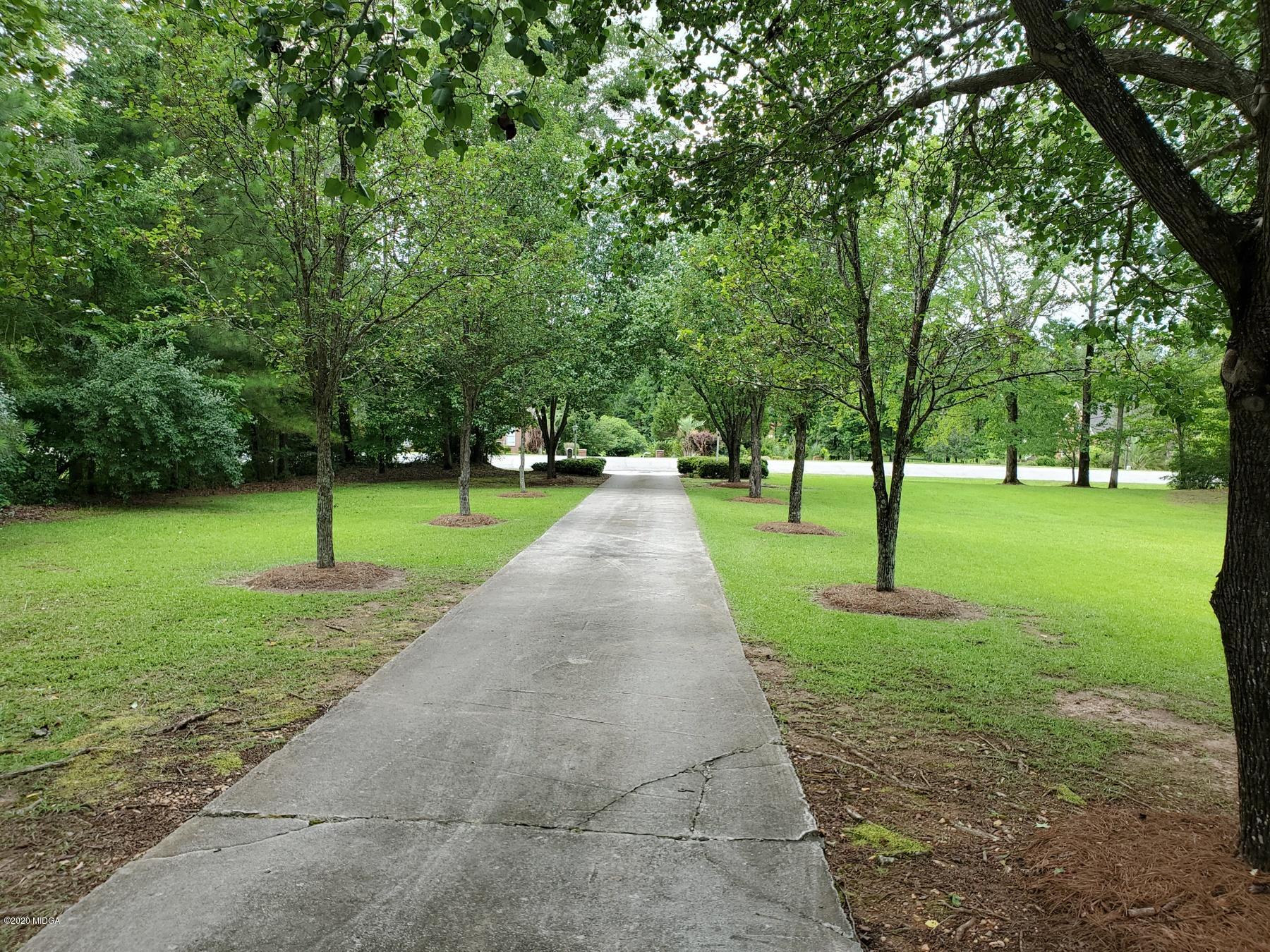 144 Gates Road Lizella, GA 31052 - Photo 8 of 44 a park with lots of trees and plants