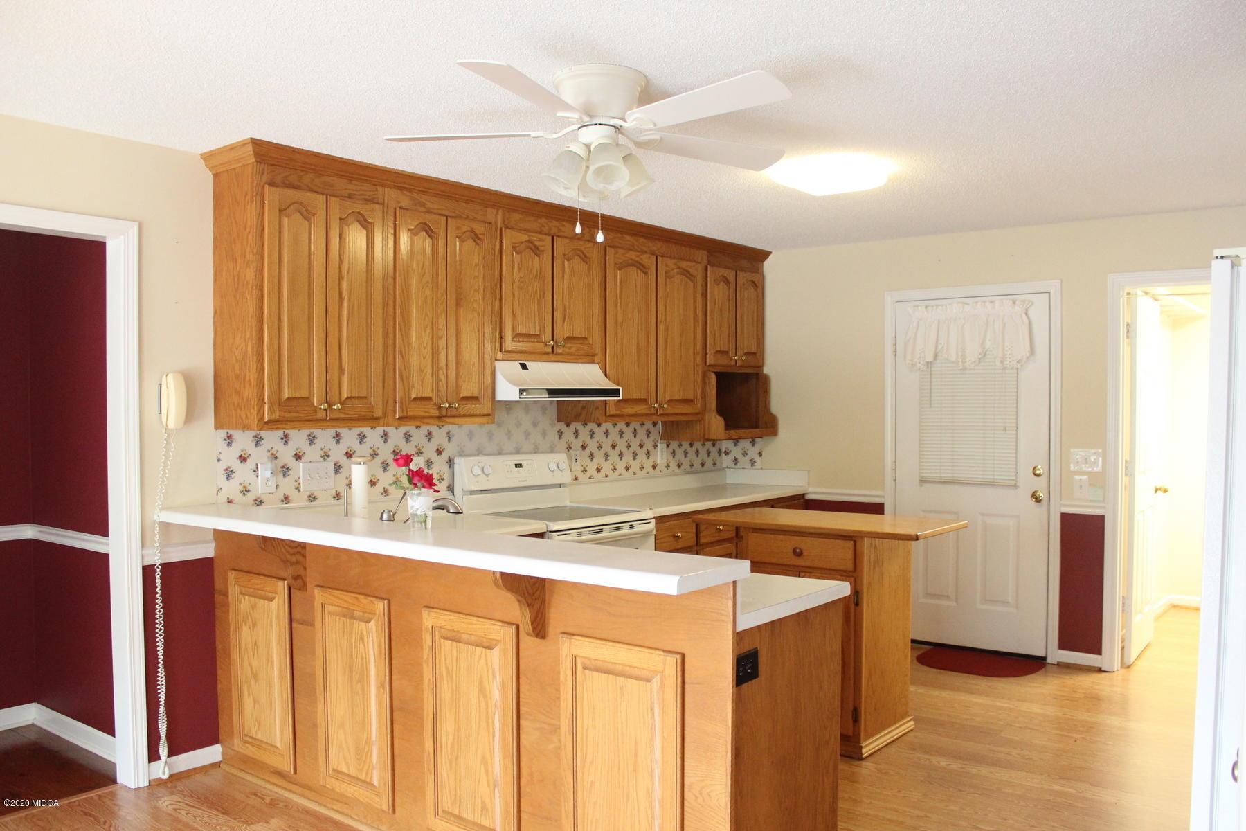 144 Gates Road Lizella, GA 31052 - Photo 9 of 44 a kitchen with stainless steel appliances granite countertop a sink stove and refrigerator