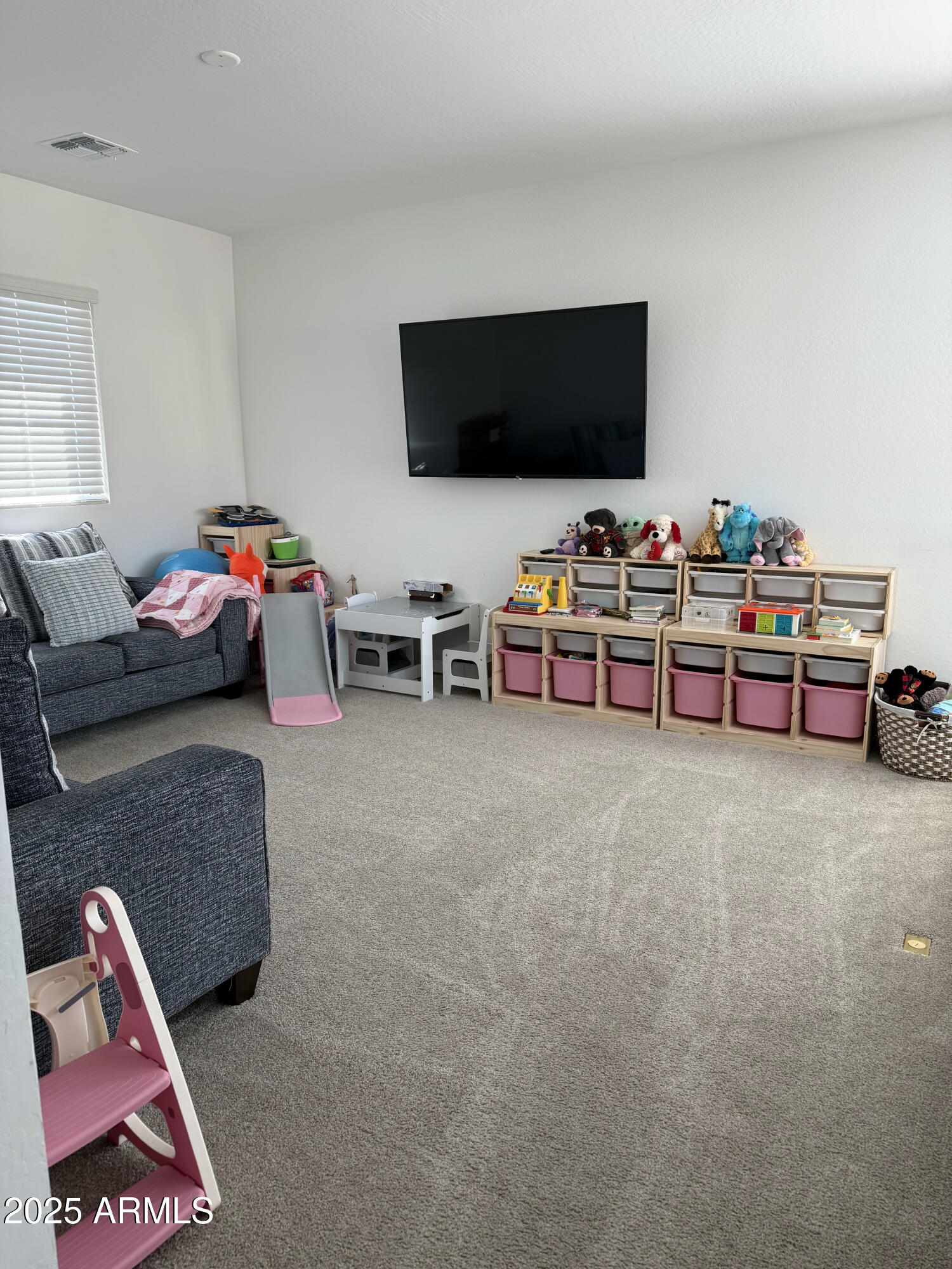 9223 East Sphere Avenue Mesa, AZ 85212 - Photo 11 of 14 a living room with furniture and a flat screen tv