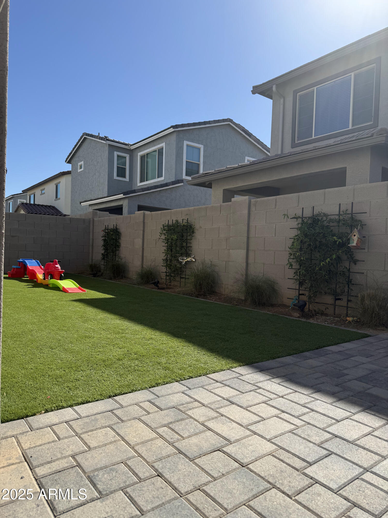 9223 East Sphere Avenue Mesa, AZ 85212 - Photo 13 of 14 a front view of a house with garden