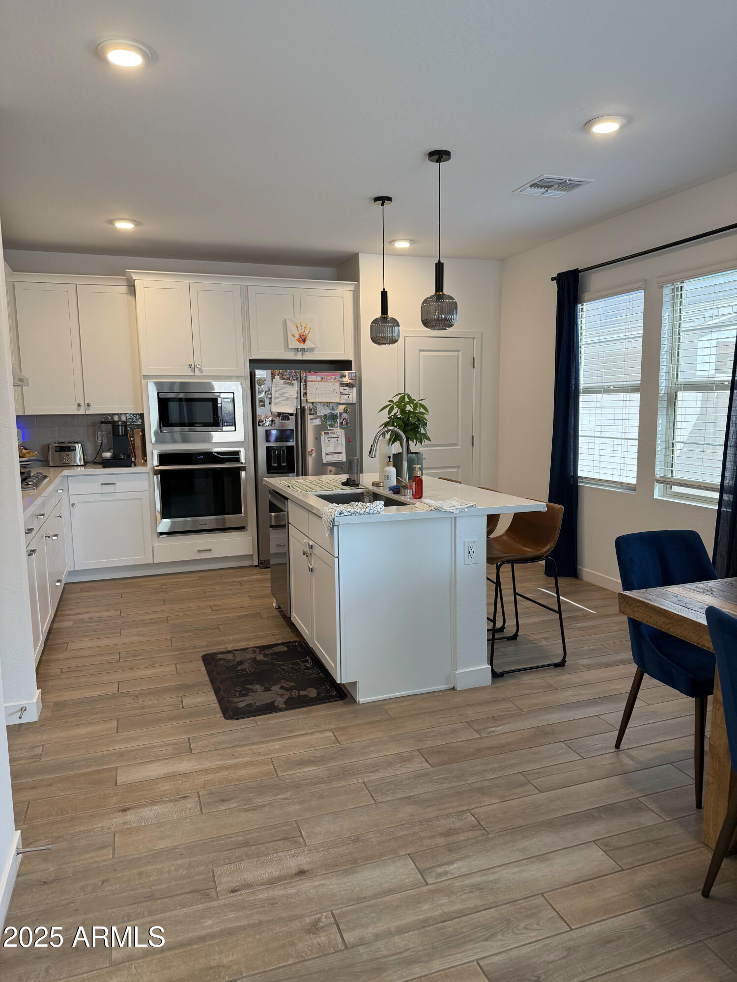 9223 East Sphere Avenue Mesa, AZ 85212 - Photo 2 of 14 a kitchen with a sink cabinets and window