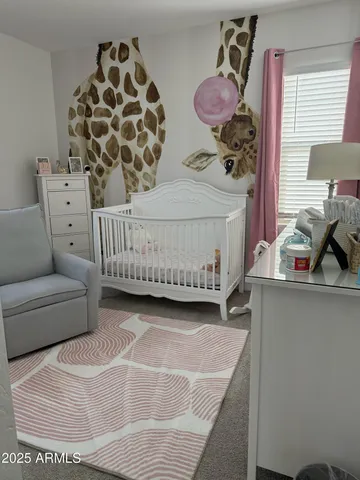 a bedroom with furniture and a window