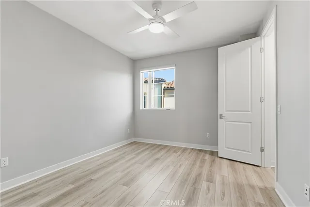 a bathroom with a sink a toilet and a large mirror