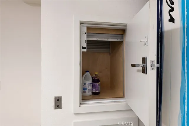a view of swimming pool with a table and chairs