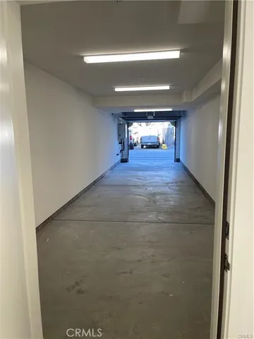 a view of a house with swimming pool and sitting area